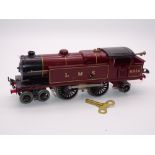 O GAUGE MODEL RAILWAYS: A HORNBY Series clockwork No. 2 LMS 4-4-2 tank locomotive numbered 6954 -