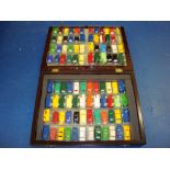 VINTAGE TOYS: A wooden presentation case containing 95 assorted TRI-ANG MINIX cars together with a