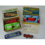 VINTAGE TOYS: A battery operated MARX racing car - together with a WRENN Wonder Boat set and two