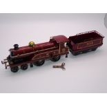 O GAUGE MODEL RAILWAYS: A HORNBY Series clockwork No. 2 LMS 4-4-0 locomotive and tender numbered