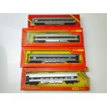OO GAUGE MODEL RAILWAYS: A group of TRI-ANG Transcontinental coaches in later Canadian CN livery,
