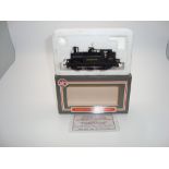 OO GAUGE MODEL RAILWAYS: A DAPOL Terrier steam locomotive in Southern Railway wartime livery with