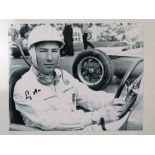 AUTOGRAPH: A black/white 10 x8 photograph signed by and featuring STIRLING MOSS - this item has been