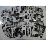 A large group of black/white film stills, some possibly reproduction from a wide selection of