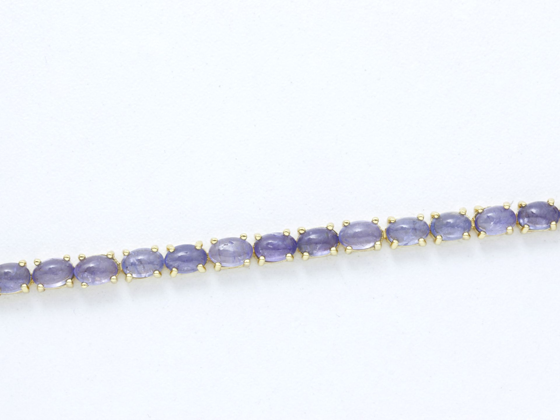 Bracelet articulé en vermeil 800 millièmes, orné d'une ligne de cabochons de [...]