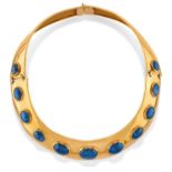 A 18K yellow gold and sapphire necklace - A 18K yellow gold and sapphire necklace - [...]