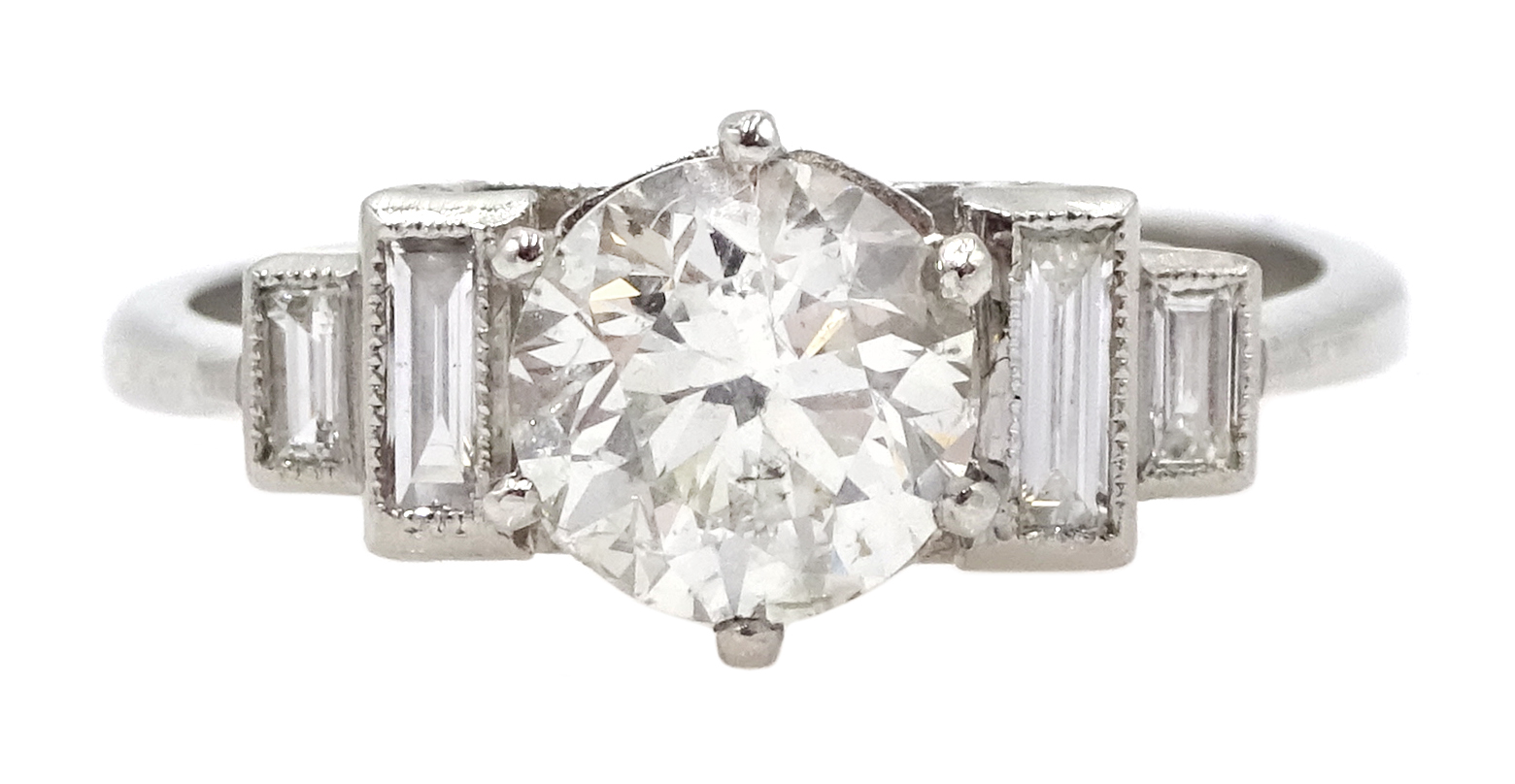 Art Deco style platinum ring set with central old cut diamond and diamonds to shoulders, central di