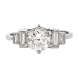 Art Deco style platinum ring set with central old cut diamond and diamonds to shoulders, central di