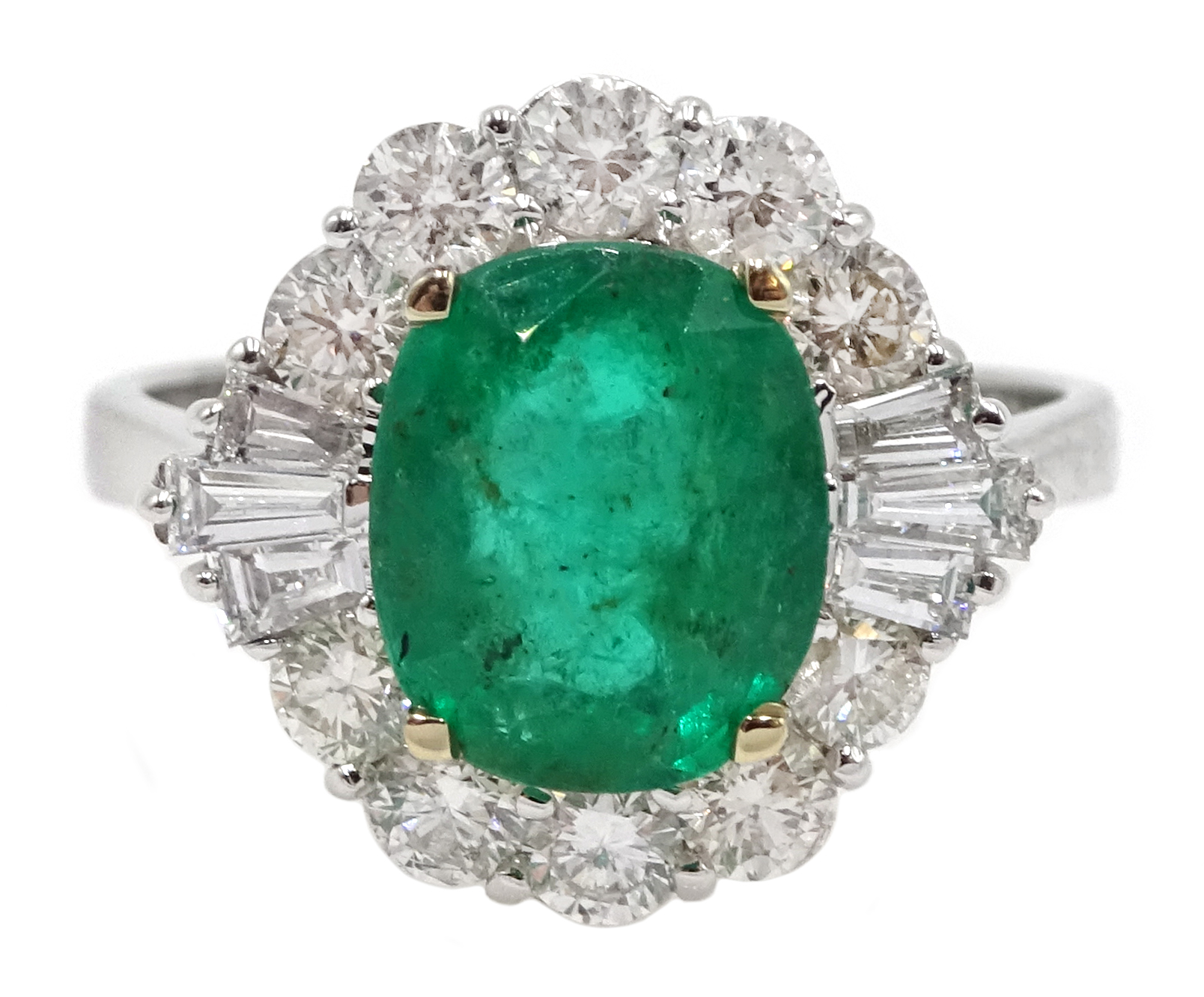 18ct white gold, emerald and diamond ring, set with a central oval shaped emerald, emerald total wei