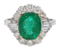 18ct white gold, emerald and diamond ring, set with a central oval shaped emerald, emerald total wei