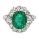 18ct white gold, emerald and diamond ring, set with a central oval shaped emerald, emerald total wei