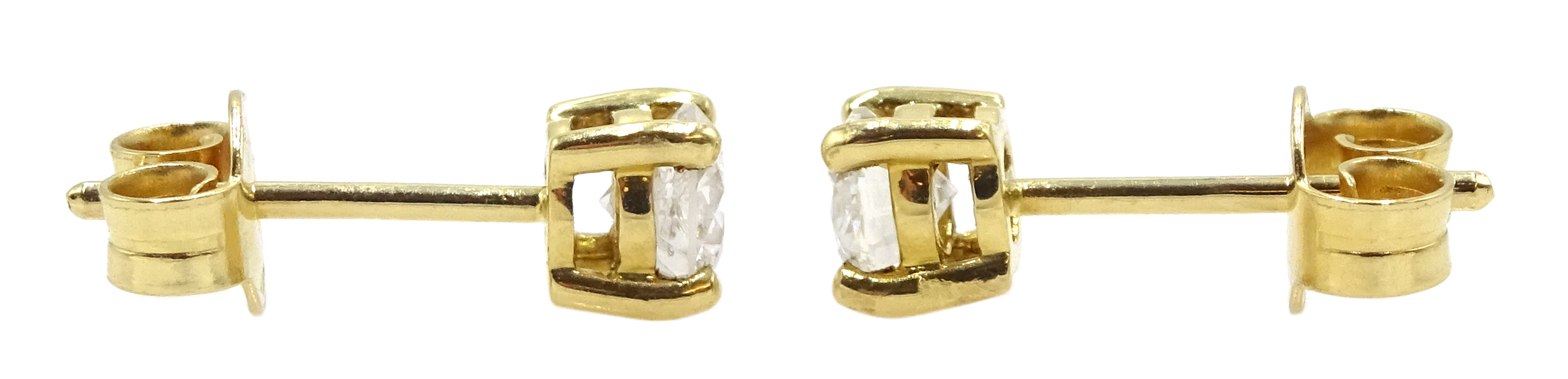 Pair of 18ct gold and diamond solitaire stud earrings, diamond total weight approx 0.65 carat - Image 2 of 3