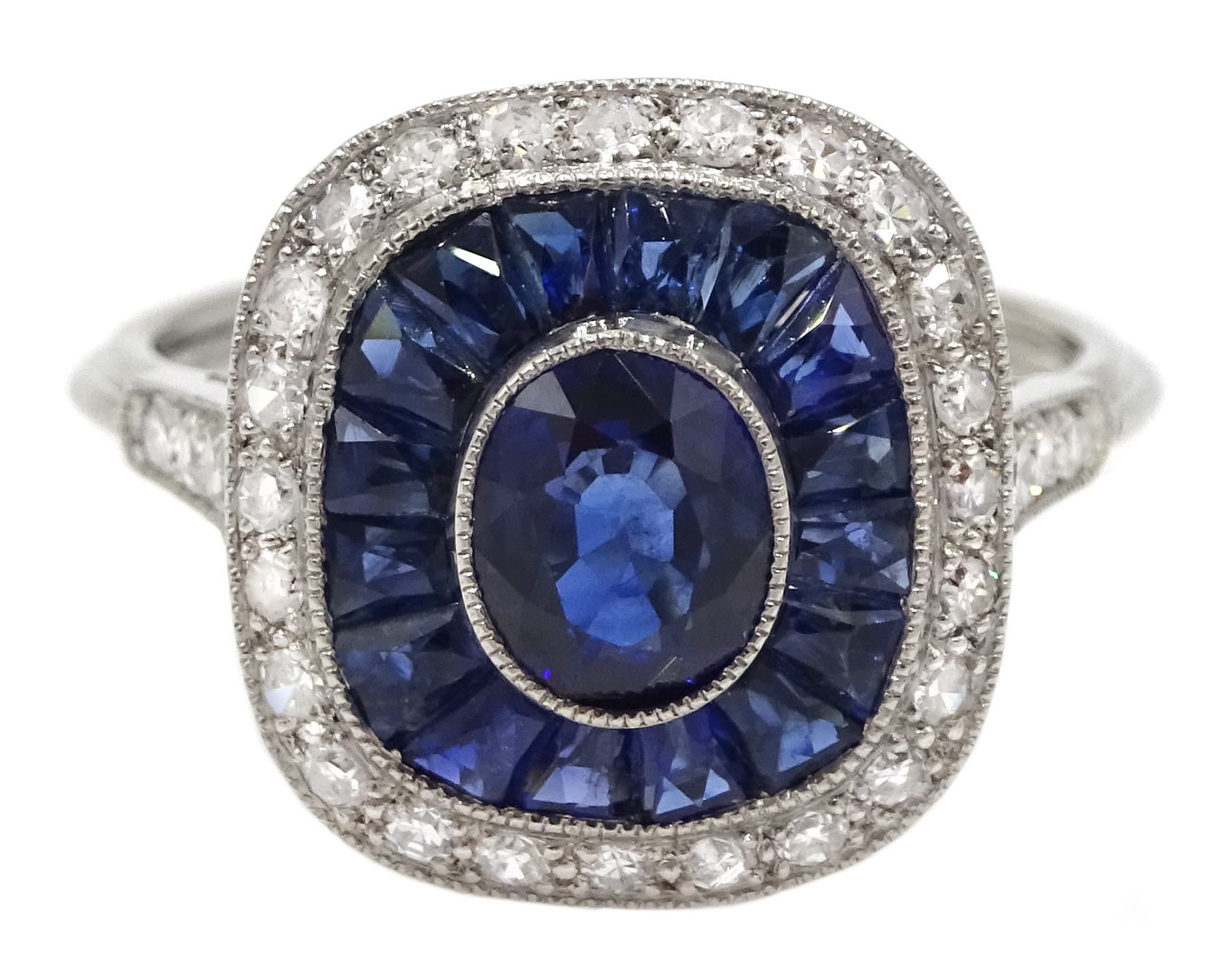 Art Deco style platinum, sapphire and diamond ring, centre oval shaped sapphire surrounded by a hal