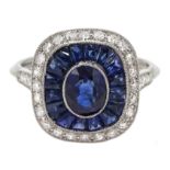 Art Deco style platinum, sapphire and diamond ring, centre oval shaped sapphire surrounded by a hal