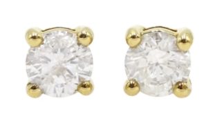 Pair of 18ct gold and diamond solitaire stud earrings, diamond total weight approx 0.65 carat