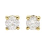 Pair of 18ct gold and diamond solitaire stud earrings, diamond total weight approx 0.65 carat