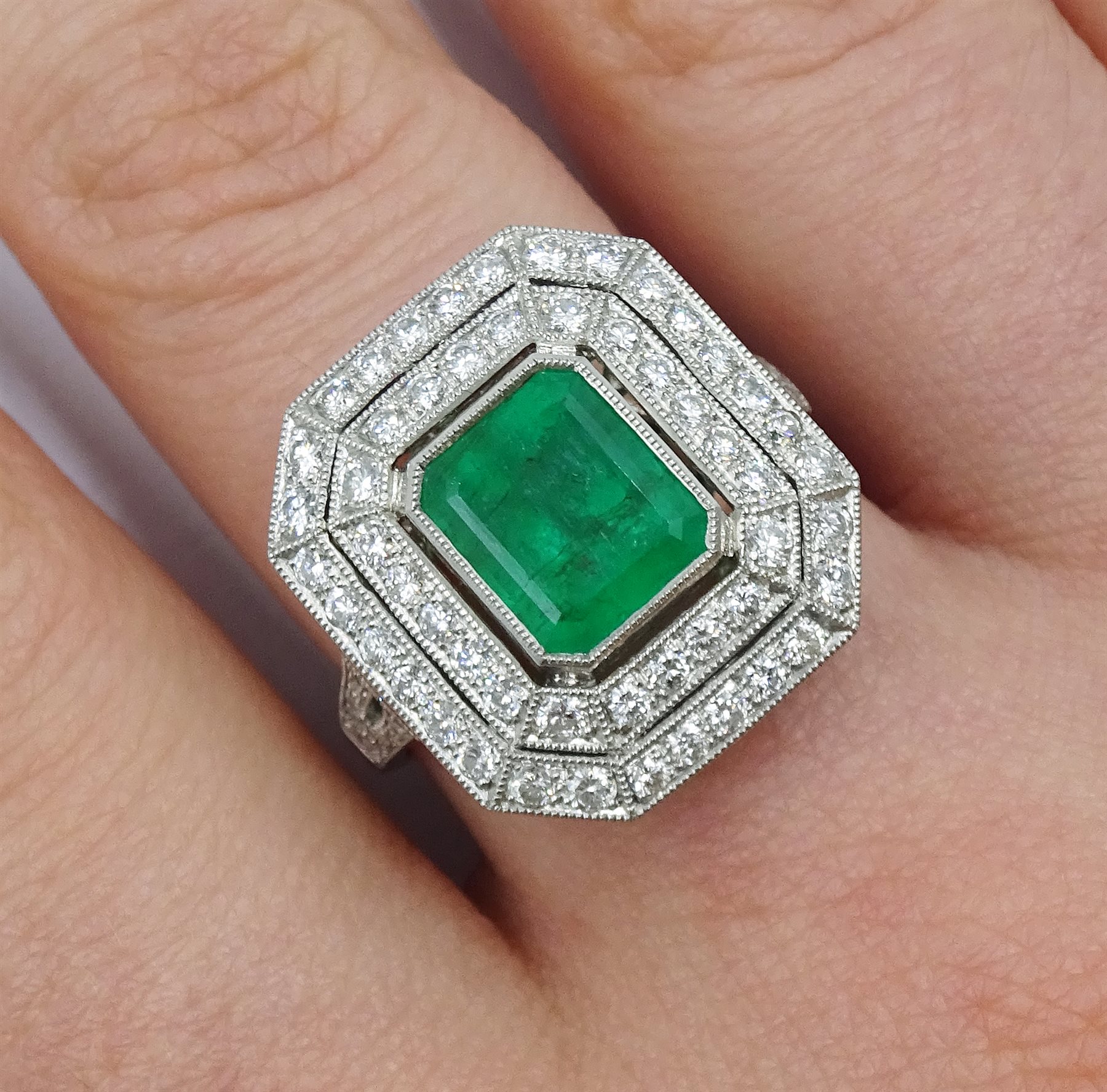 Platinum emerald and double row diamond ring, with diamond set shoulders, emerald approx 1.85 carat, - Image 2 of 5