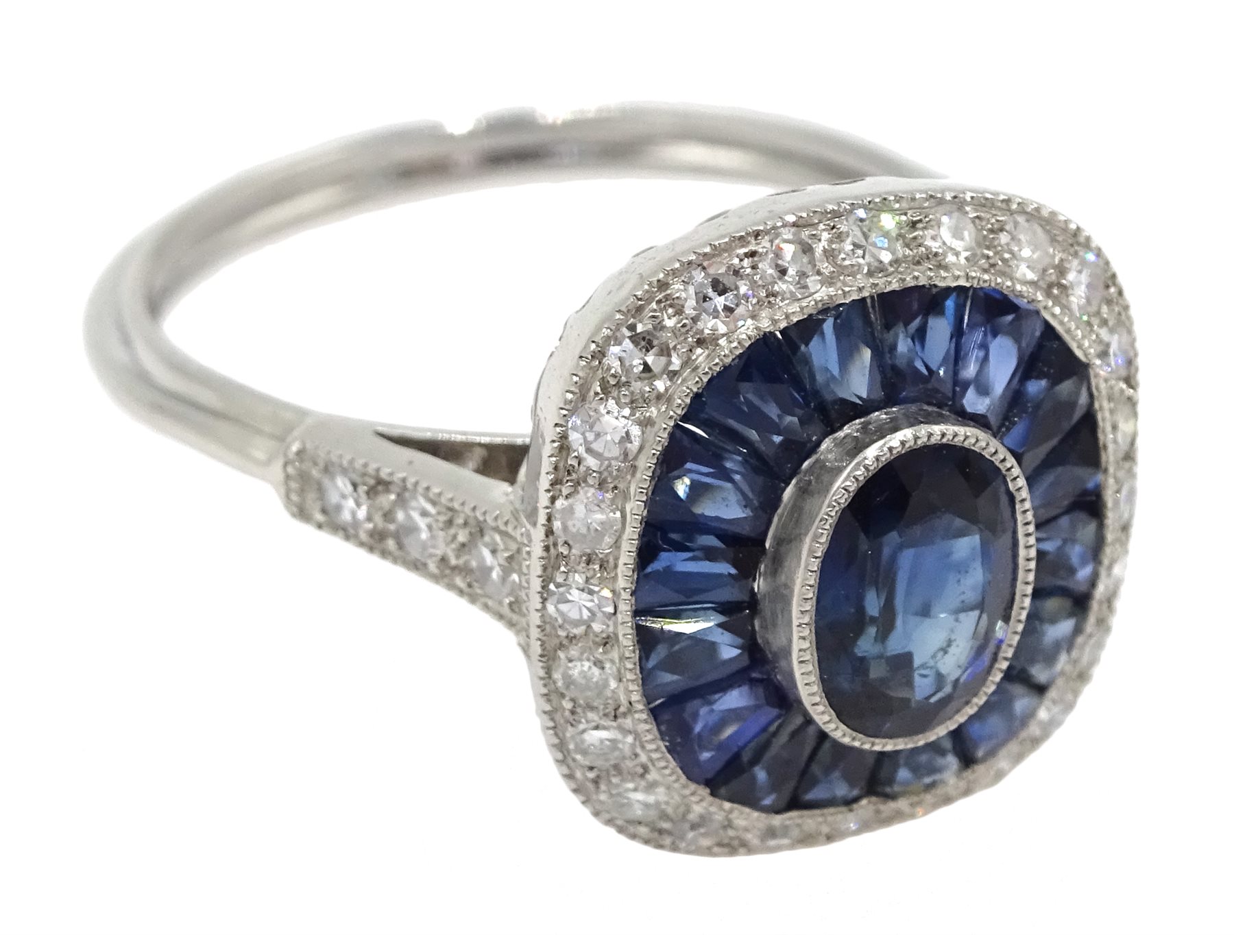 Platinum sapphire and diamond ring, the central oval sapphire surrounded by halo of calibre cut - Image 3 of 5