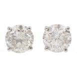 Pair of 18ct white gold diamond stud earrings, stamped 750, diamond total weight 3.52 carat