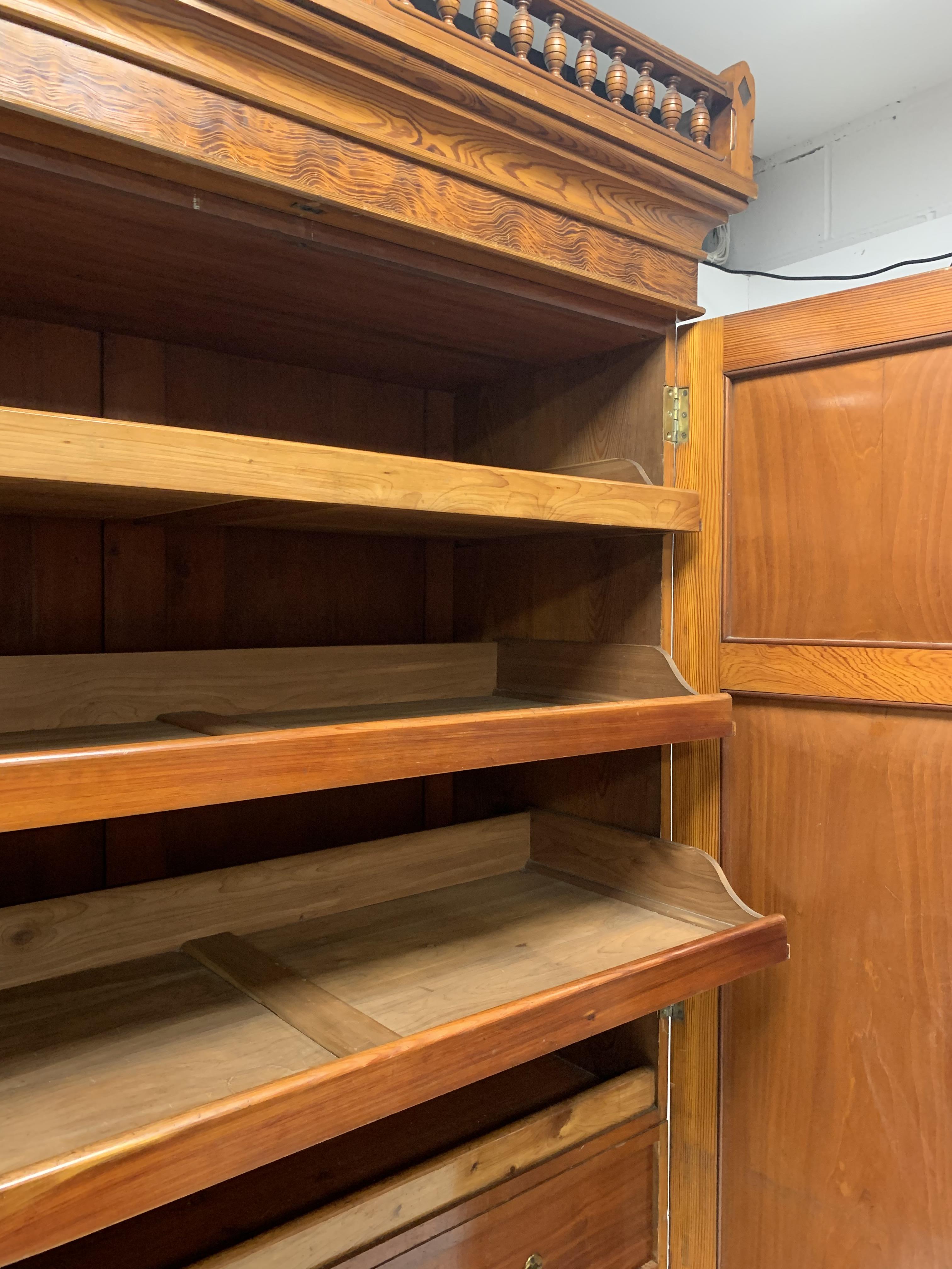 Late Victorian pitch pine triple wardrobe, turned gallery pediment over projecting cornice, - Image 8 of 9