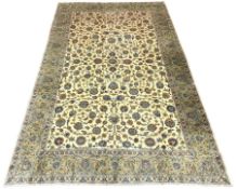 Large Persian Kashan carpet, ivory ground with interlacing foliage, decorated with stylised flower