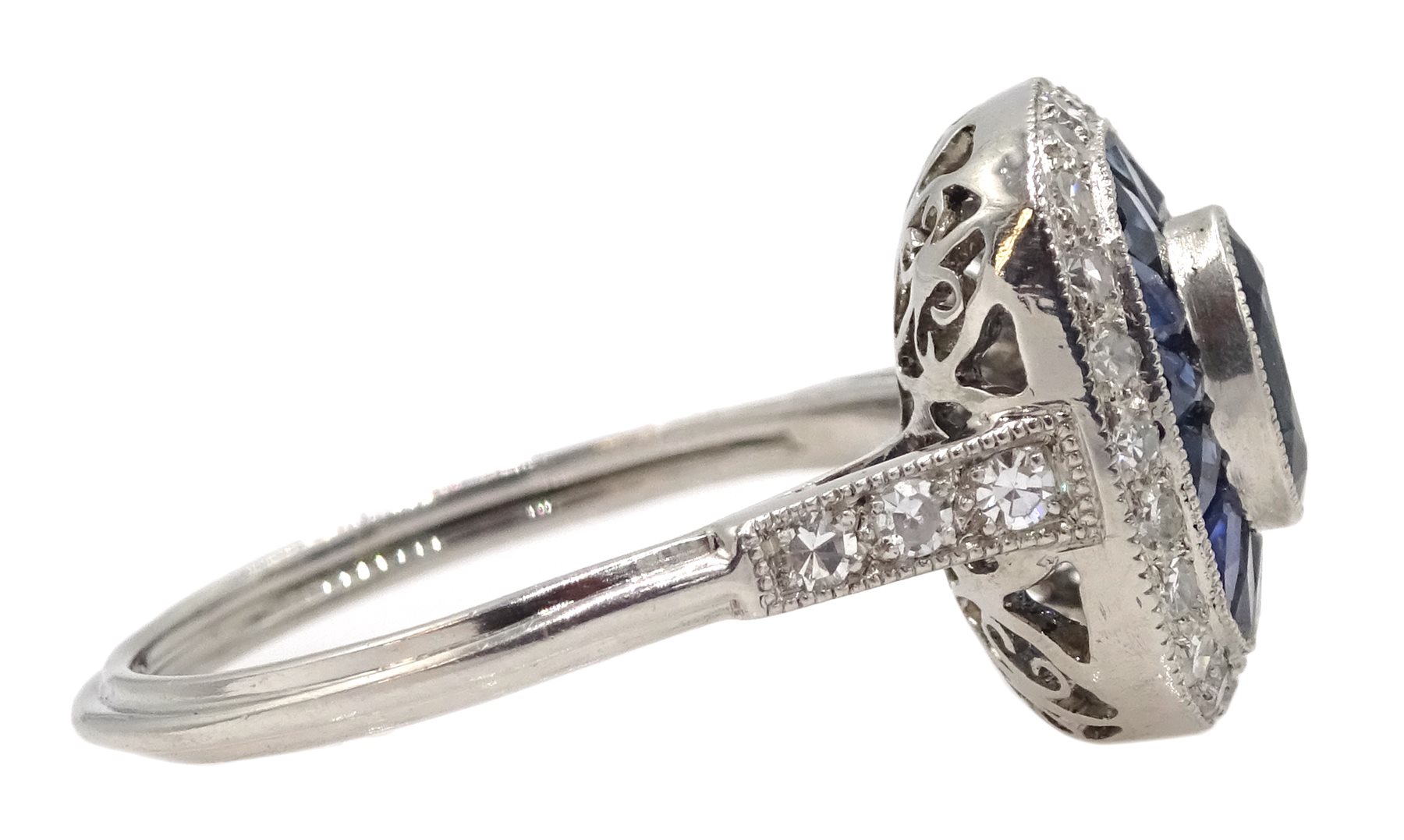 Platinum sapphire and diamond ring, the central oval sapphire surrounded by halo of calibre cut - Image 5 of 5
