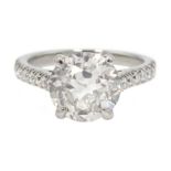 Platinum old cut diamond solitaire ring with diamond set shoulders, hallmarked, central diamond 2.10