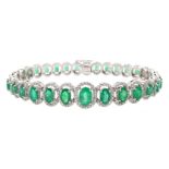 18ct gold graduating oval emerald bracelet, each emerald surrounded by brilliant cut diamonds, total