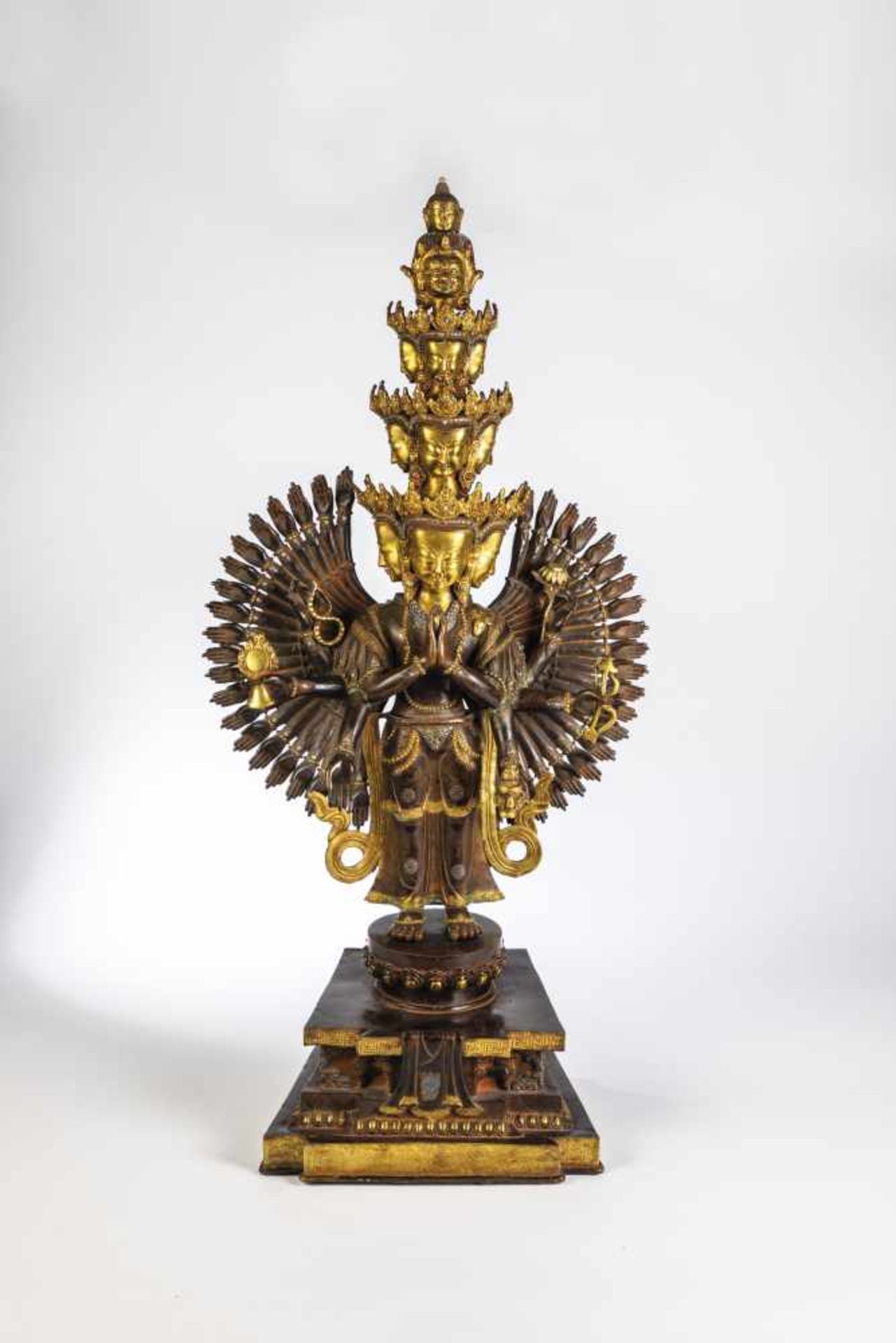 Avalokiteshvara. China, 18th / 19th century. Eight-armed deity on base. Bronze partiallygilded and