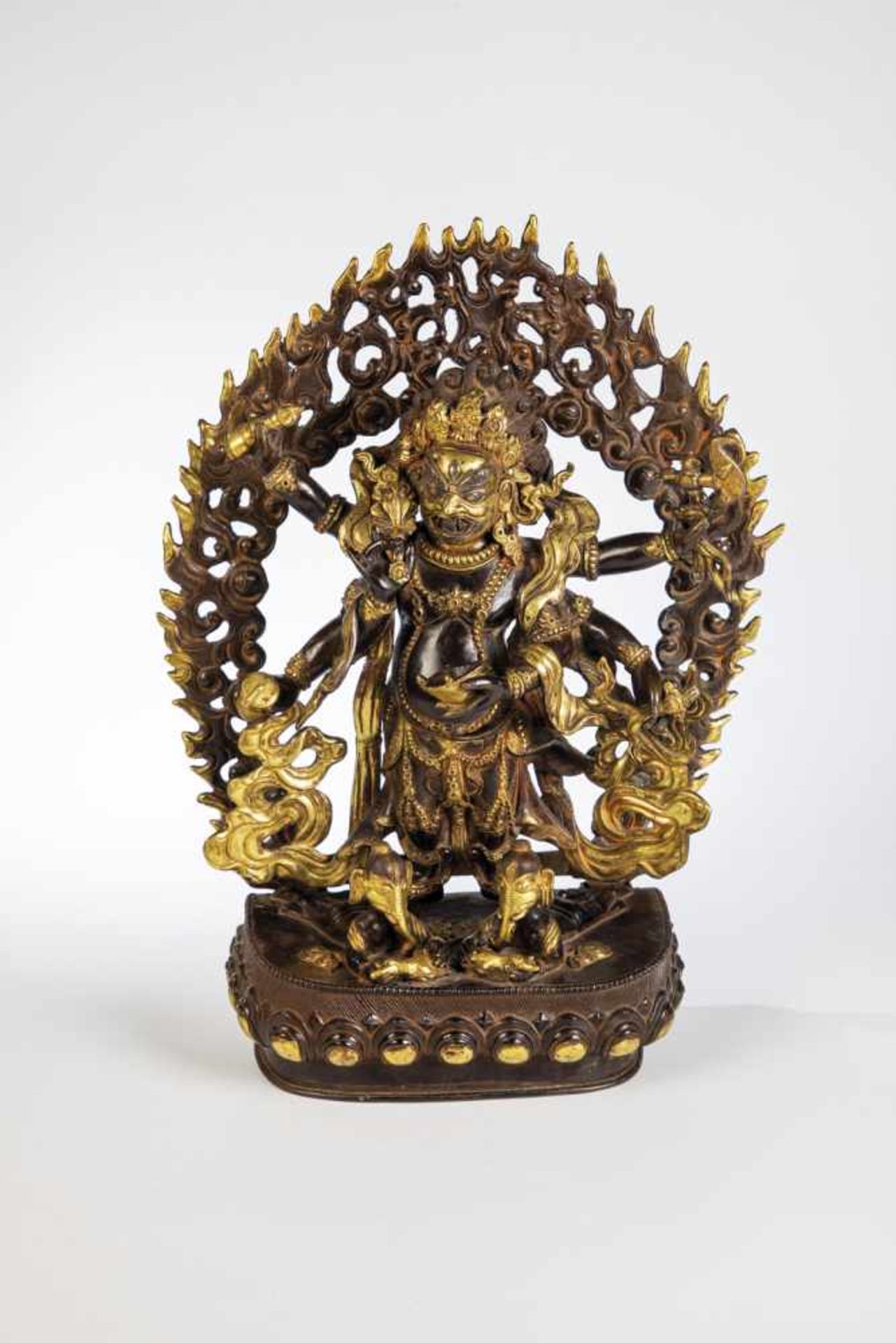 Mahakala. Tibet, 19th century. Six-armed deity on base. Bronze partially gilded andpainted. 40 cm