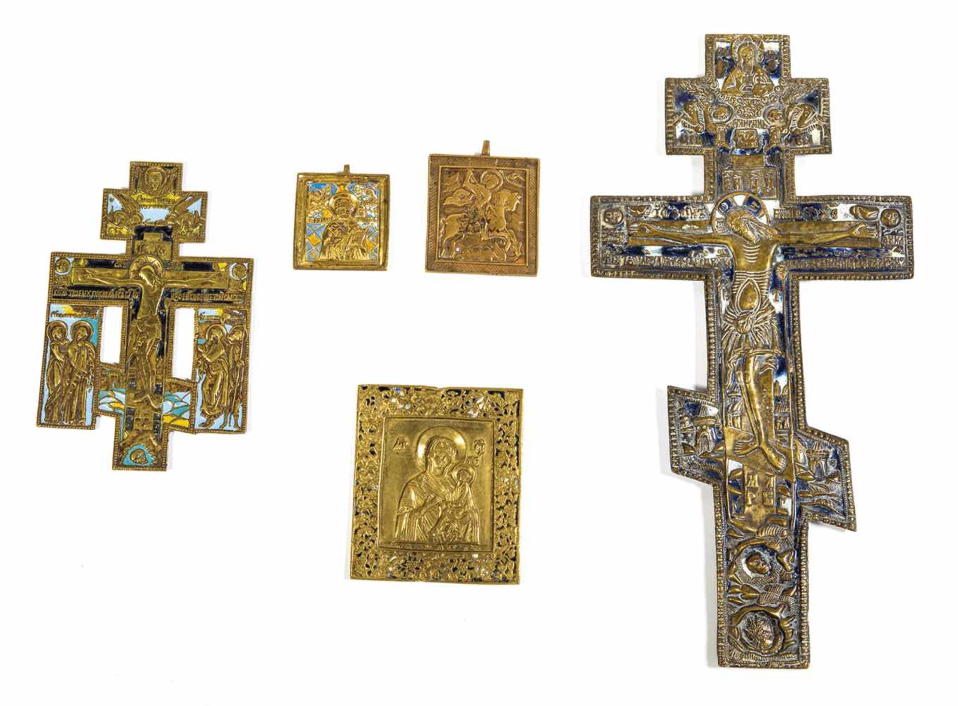 Five brass icons. Russia, 19th /20th century. Cast in relief. Four with polychrome enamel.Losses.