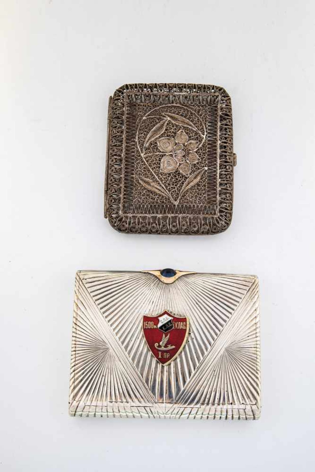 Two silver cigarette cases. Moscow, 1908-1917 / 19th century. Silver filigree work. 9 cmlong, 70 gr.