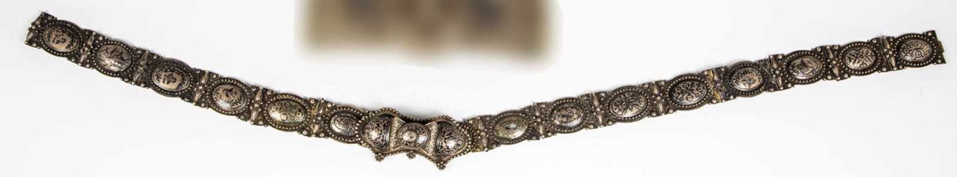 A silver and niello belt. Probably Tiflis, late 19th century. 15 chains with nielloeddecor. Ribbon-