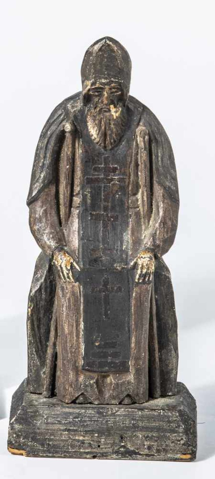 A carved wood figure of St. Nil Stolbenskiy. Russia, 19th century. Cast in relief. Onrectangular