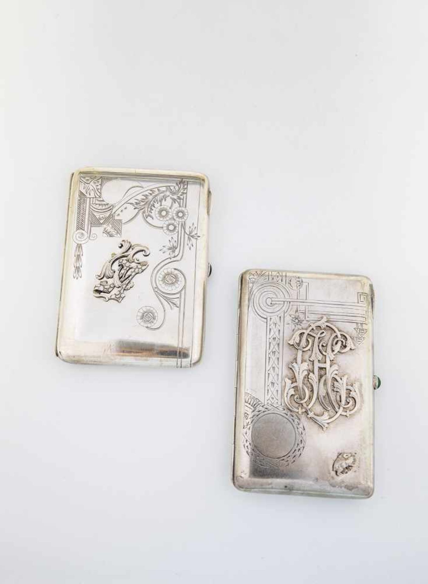 Two silver cigarette cases. Moscow, 1908-1917. One with gilt interior. Hinged lid withengraved decor