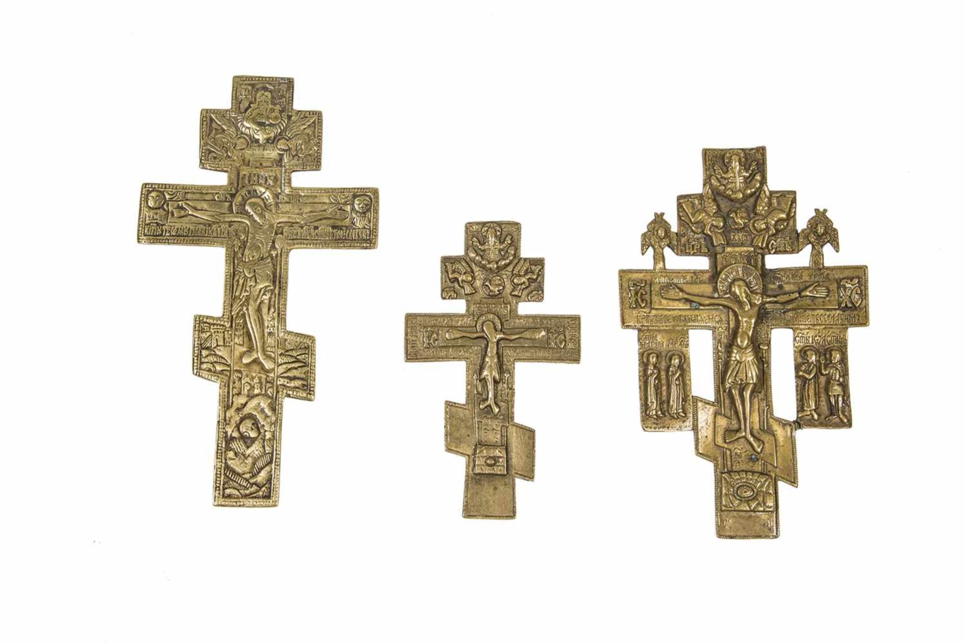 Three bass crosses. Russia, 18th-20th century. Two with cyrillic inscriptions. Losses. 13- 19 cm