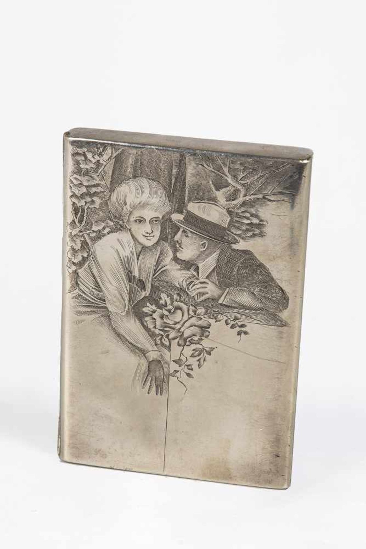 A silver cigarette case with couple. Moscow, 1908-1917. Rectangular form. Engraved couple.Stamped