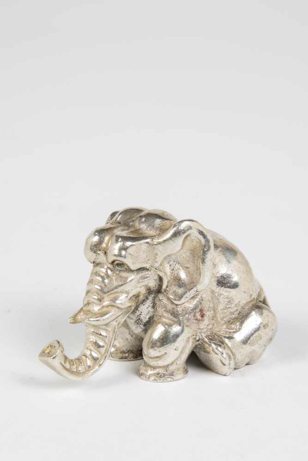 A realistically cast silver elephant. 20th century. Beariung spurious Russian marks. 5.5cm long, 127