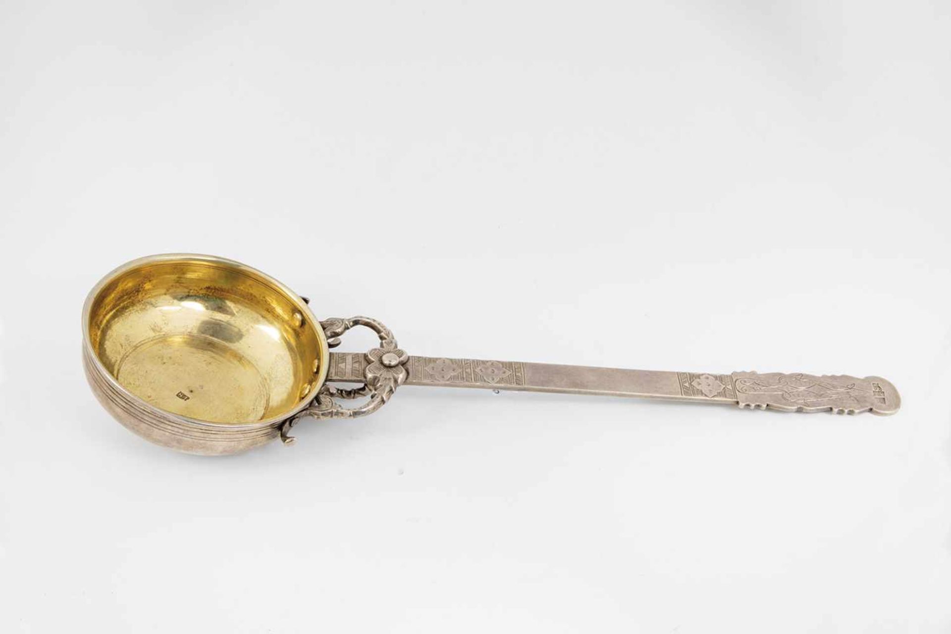 A silver partial-gilt kovsh. Tiflis, 1856. Engranved handle. Stamped with hallmark 1856,assayer'