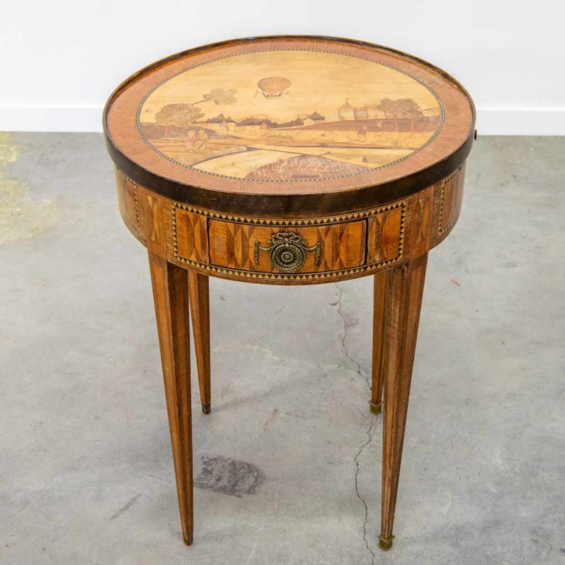 Maître DUBOISAntique game table, decorated with a marquetry 'Mongolfier' balloon and landscape and a