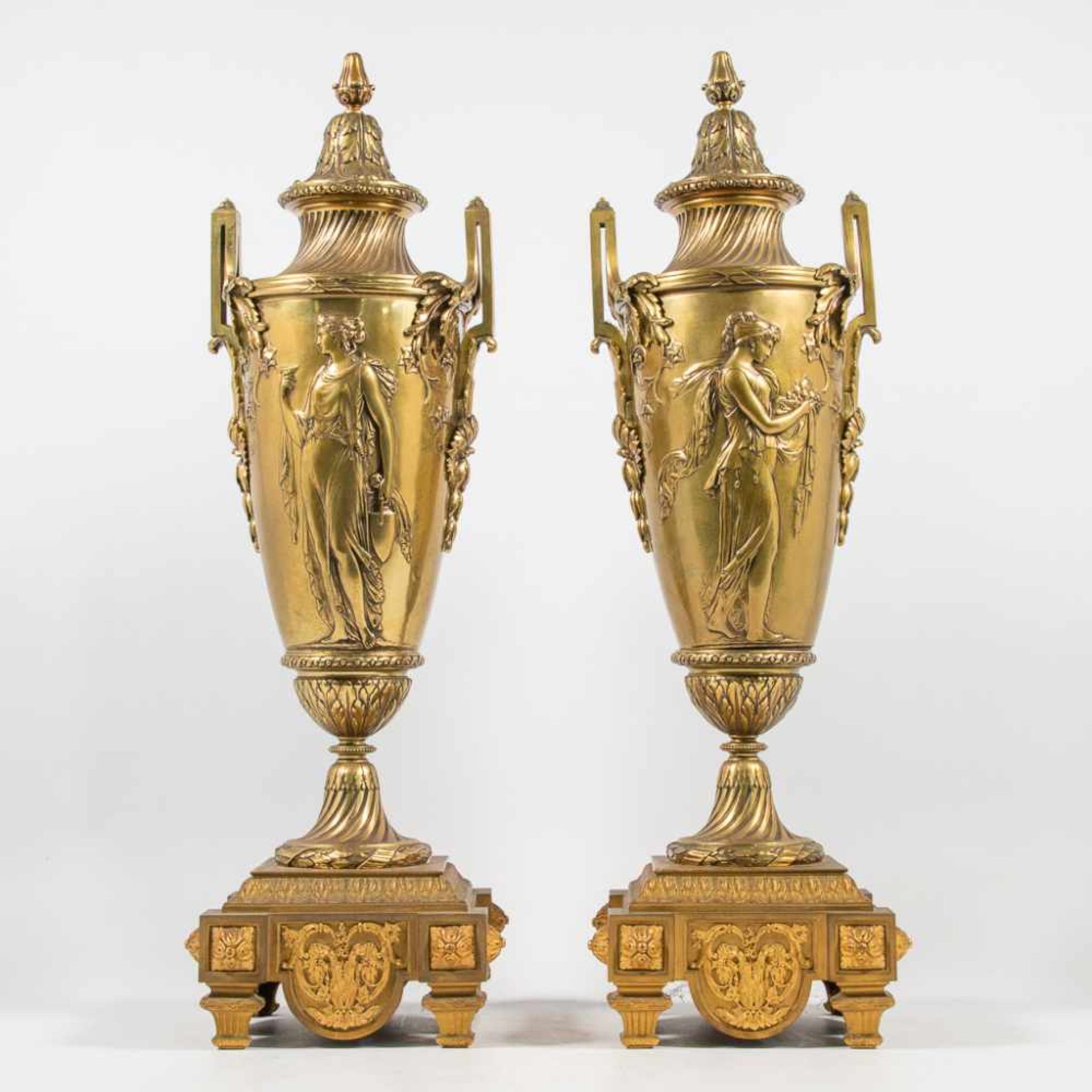 Pair bronze vases with ancient roman decor