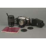 An Olympus OM20 SLR Camera,