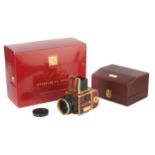 A Hasselblad 503CW Gold Supreme 50th Anniversary Camera,