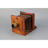 An E & T Underwood Quarter Plate Mahogany Tailboard Camera,