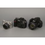 Three Nikon Digital Cameras,