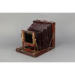 An A & N Auxiliary C.S. Ltd 'The Society' Half Plate Mahogany Field Camera,