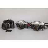Three Canon SLR Cameras,