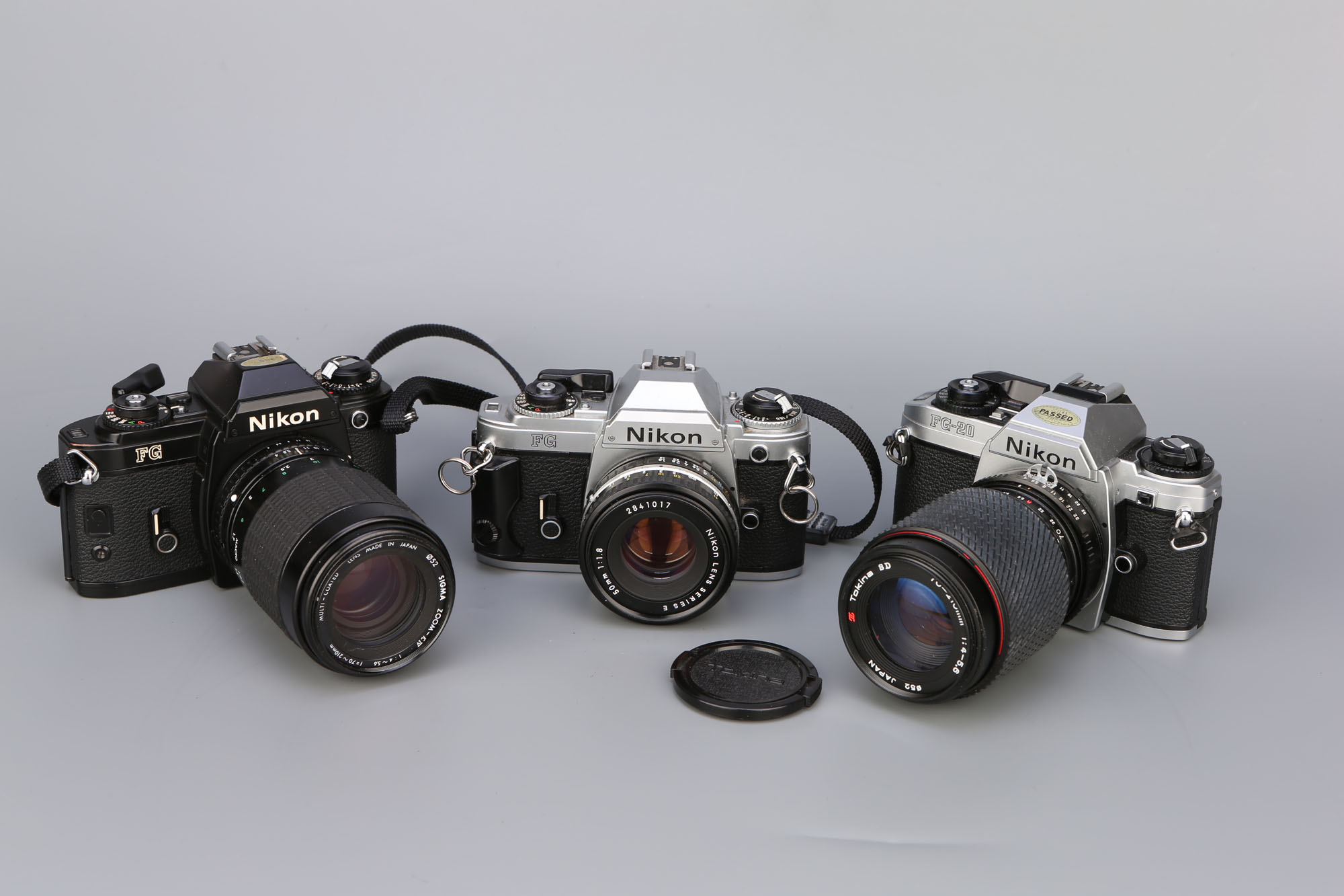 Three Nikon SLR Cameras,