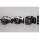 Three Minolta SLR Cameras,