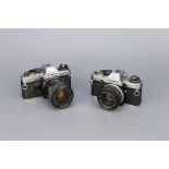 Two Olympus OM-10 SLR Cameras,